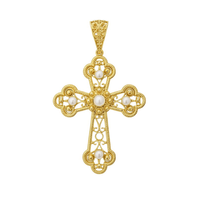 Una cruz de filigrana delicada y artesanal, elaborada en baño de oro y realzada con perlas naturales seleccionadas una a una. Un diseño elegante que combina tradición y modernidad, perfecto para quienes buscan una joya especial con simbolismo y estilo. Ideal para usar a diario o para regalar en ocasiones significativas.