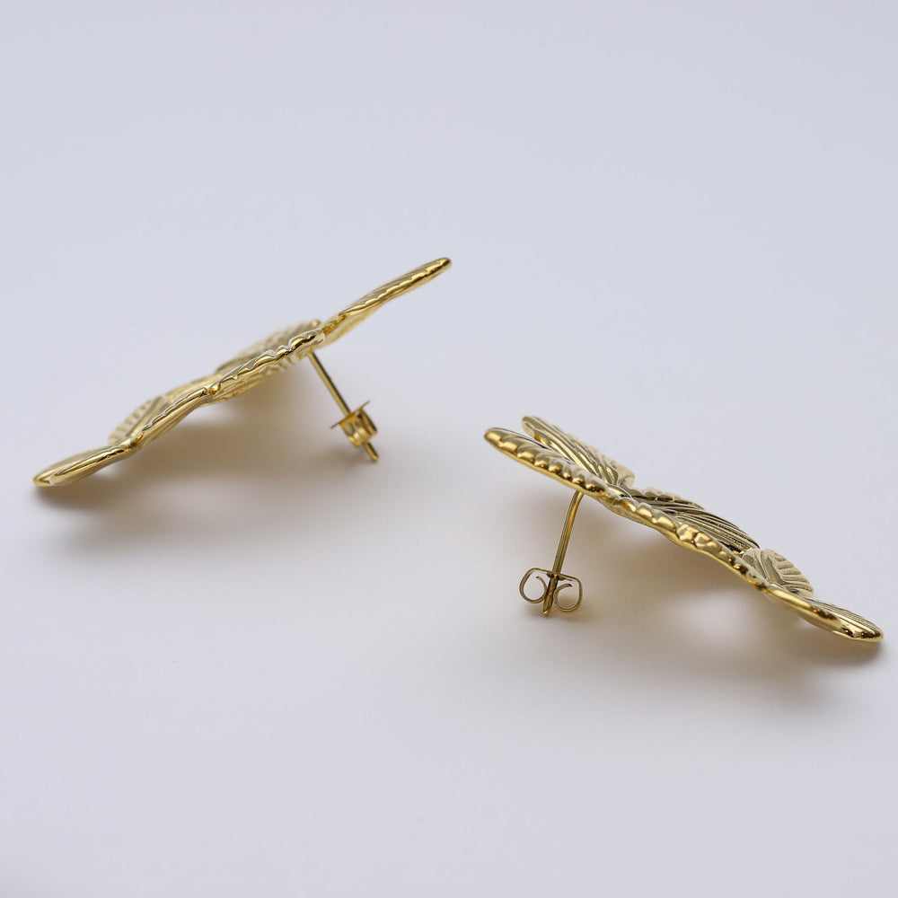 
                      
                        Pendientes mariposa largos de acero inoxidable y baño de oro de 18 kt- Bendita Eva
                      
                    