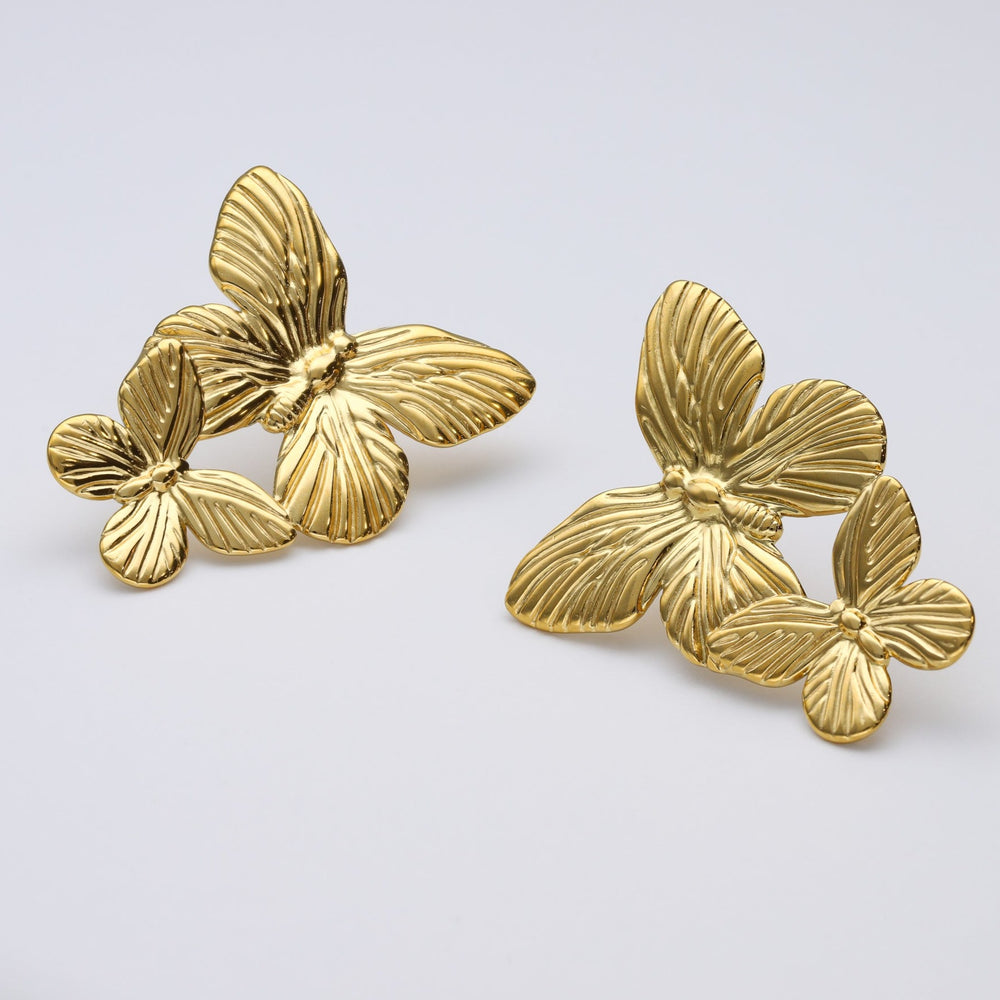 
                      
                        Pendientes mariposa largos de acero inoxidable y baño de oro de 18 kt- Bendita Eva
                      
                    