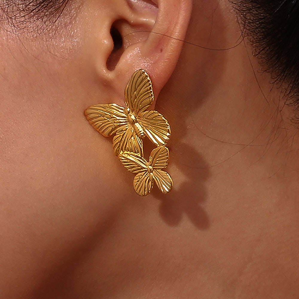 Pendientes mariposa largos de acero inoxidable y baño de oro de 18 kt- Bendita Eva